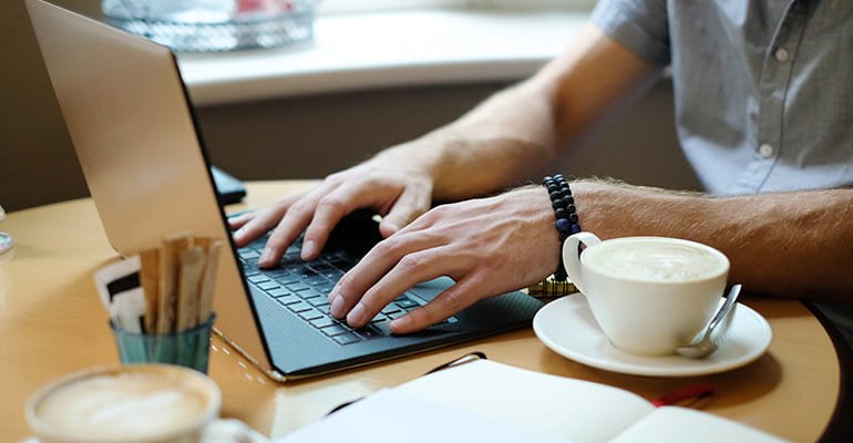 men working on laptop
